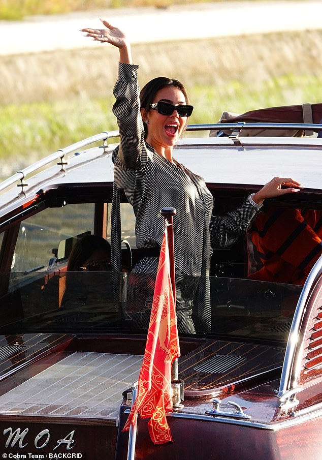 Oozing sophistication, Georgina posed for snaps from a vintage boat as she enjoyed the sunshine