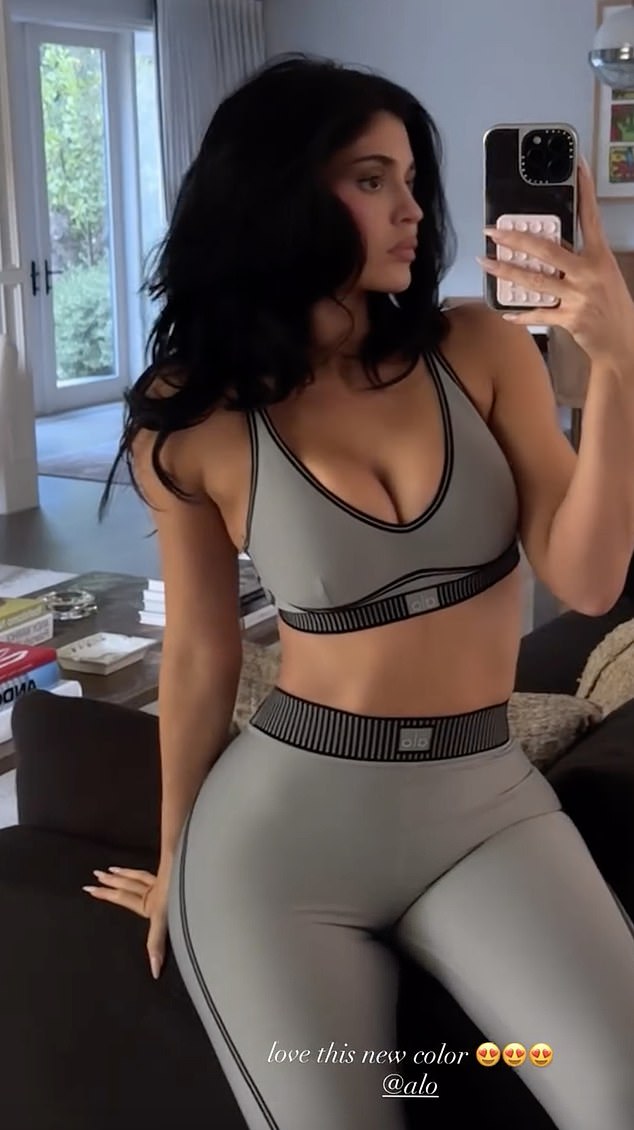 In one video, she showed off her tiny waist and tousled her bouncy blowout with her perfectly manicured hands