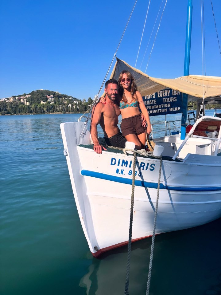 Couple posing on a boat.