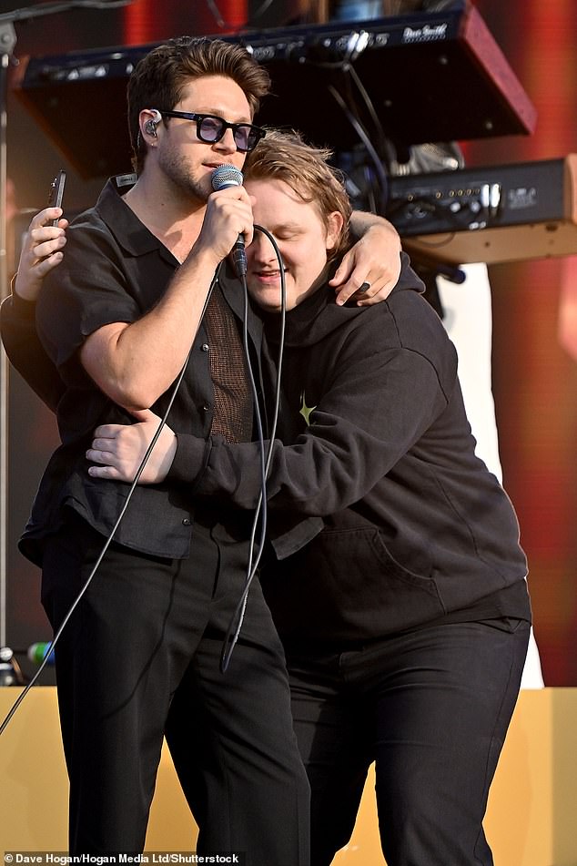 Speaking on Hits Radio the Scottish singer (R) branded the Rocket man, 78, a 'really cool due' as well as praising pal Niall Horan (L) for his support during that difficult time