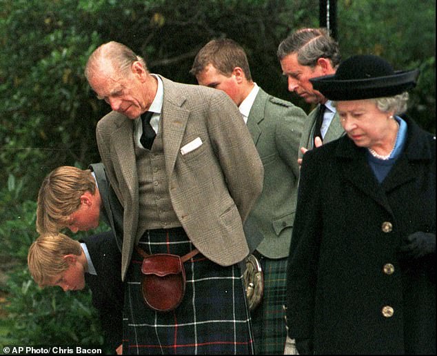 Harry, Prince William, Prince Philip, Peter Philips, Charles and Queen Elizabeth II stop to gaze at the flowers and cards of condolence laid at the gates of Balmoral Thursday September 4, 1997