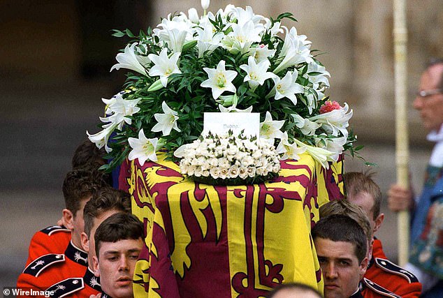 The coffin of Diana, Princess of Wales, leaves Westminster Abbey after the funeral service. The touching floral tribute from her sons says simply 'Mummy'