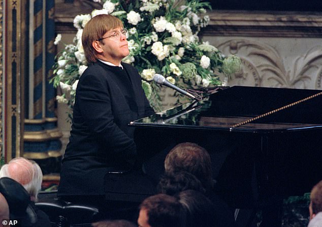 Elton John plays a specially re-written version of his song Candle in the Wind during the funeral service for Diana