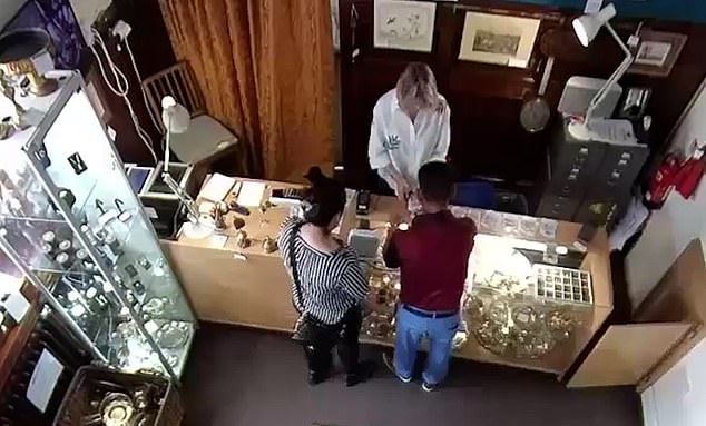 CCTV from the shop in Wotton Basset shows the couple of alleged jewellery thieves engaging with the blonde member of staff behind the counter, The should owner told the Daily Mail that the suspects used classic techniques to distract the woman inorder to take goods unnoticed