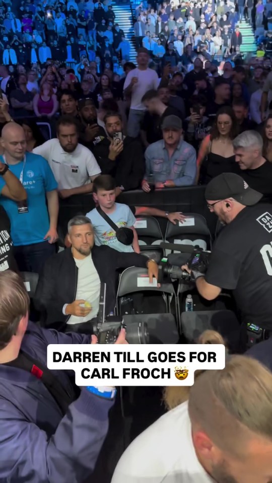 Darren Till approaching Carl Froch in a crowd.