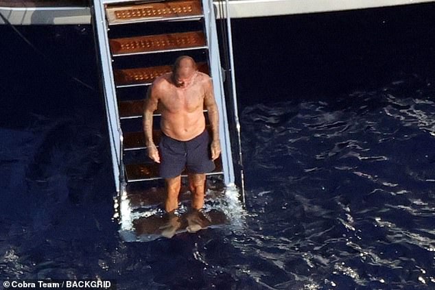 He then went shirtless and headed for a dip in the sea, showing off his muscular physique as he cooled off from the excessive Italian heat