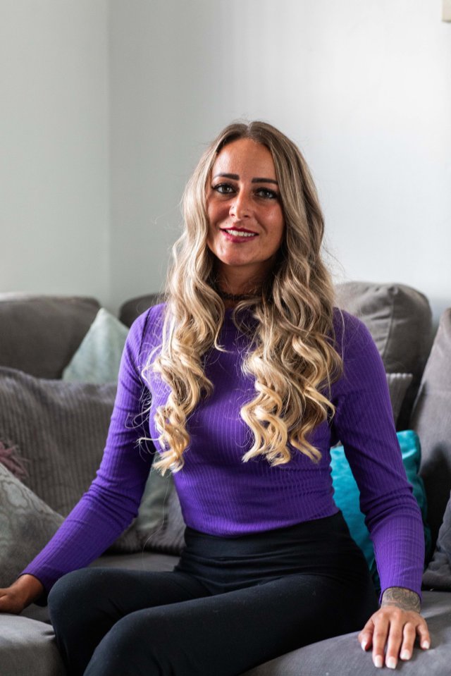 Woman sitting on a couch.