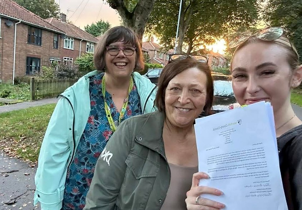 Photo of Councillor Julie Brociek-Coulton with two other women, holding a letter regarding speed cushions.