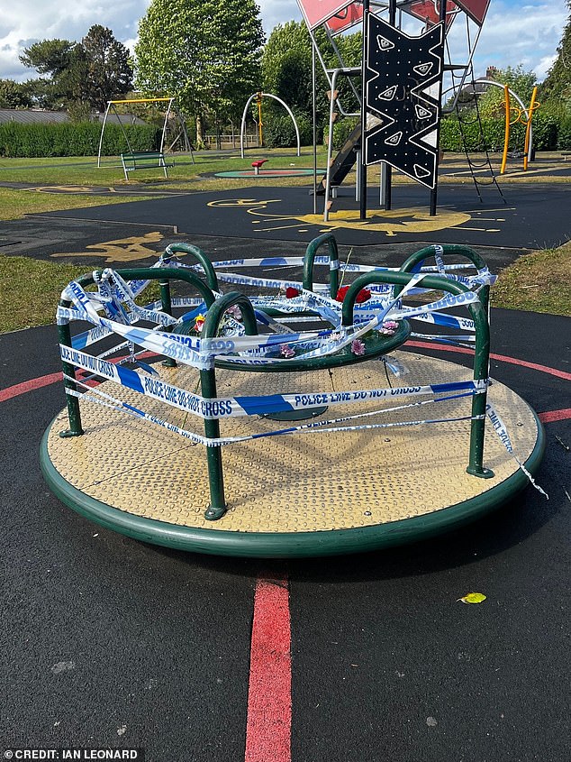 Police tape can be seen wrapped around a roundabout at the Wharton Recreation Ground near Ledward Street in Winsford, where the youngster died on Friday evening