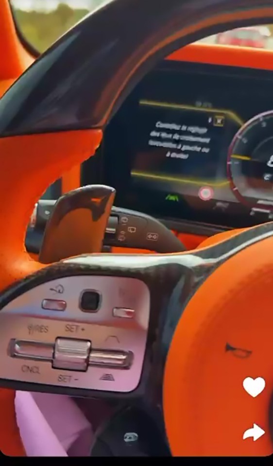Screenshot of a Snapchat video showing a car's interior while driving.
