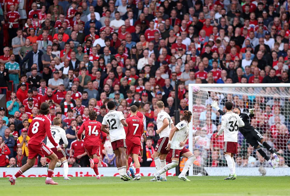 Liverpool's Szoboszlai scoring a free kick against Arsenal.