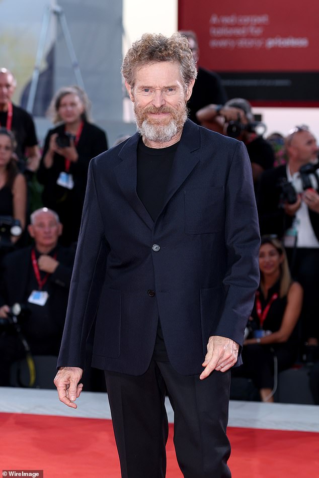 Spider Man actor Willem Dafoe, 70, cut a smart figure in a navy blazer which he wore over a black T-shirt
