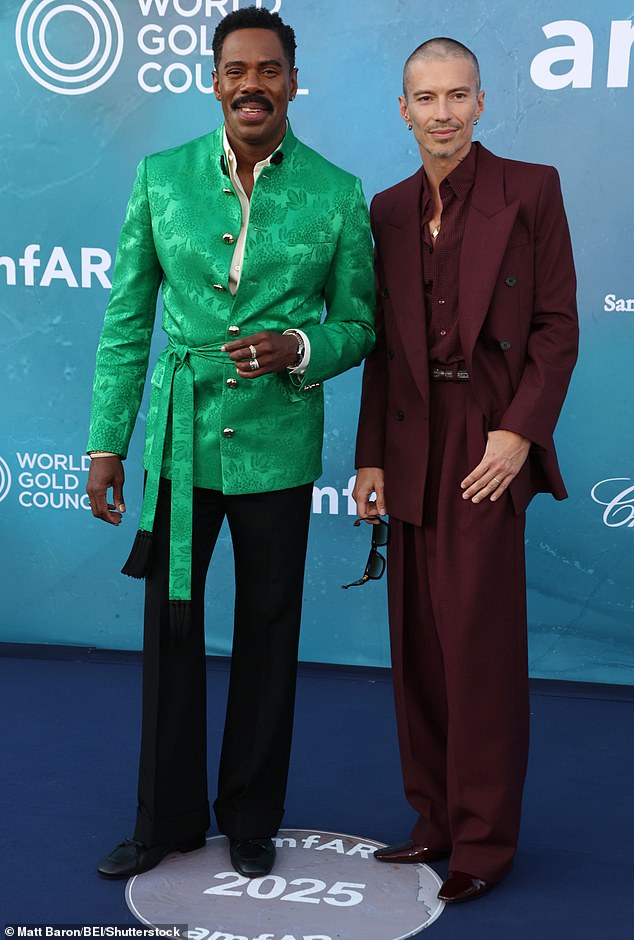 Meanwhile Colmon, 55, oozed sophistication in a green silk floral jacket complete with matching belt and statement gold buttons (pictured with husband Raúl Domingo)