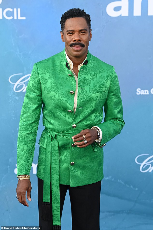 He layered it over a crisp white shirt, forgoing a tie, and smart black trousers while strutting his stuff on the red carpet in perfectly polished dress shoes