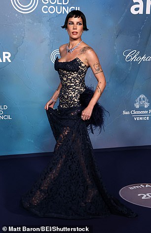 Halsey, 30, flaunted her jaw-dropping figure as she slipped into a racy black lace gown for the evening