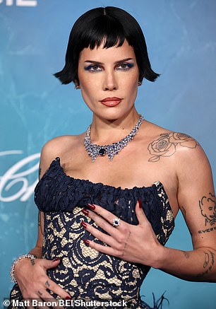 The star teased a glimpse of her lingerie toned and tattooed physique as well as her skimpy lingerie as she oozed confidence and posed with her hands on her hips