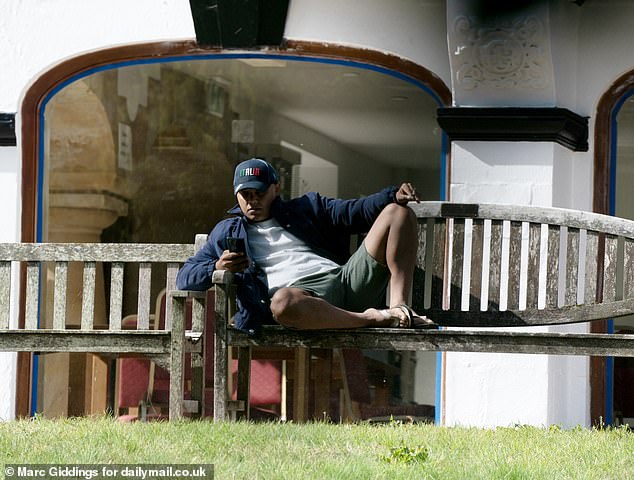 While Rees-Mogg's investigations were inconclusive and failed to provide a definitive answer, when the Daily Mail visited the Winford Manor hotel in Somerset hotel this week we confirmed migrants had been living there for three years. A young man is pictured in the hotel grounds