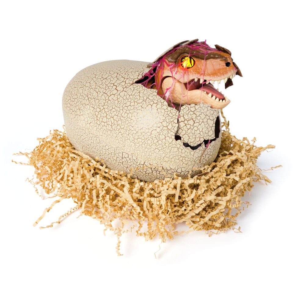 Baby dinosaur hatching from egg.