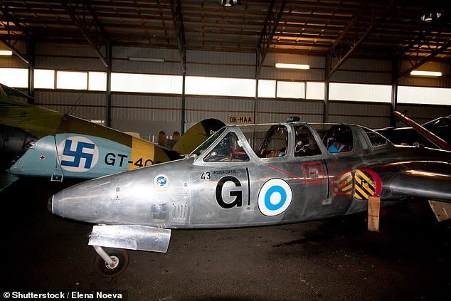 A blue swastika on a white background was emblazoned on all Finnish planes as the national symbol from 1918 to 1945. Pictured: Historic Finnish airforce planes featuring the blue swastika