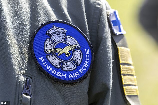 Flags will from now on bear a new emblem of a golden eagle in flight, over a blue circle, surrounded by white wings (pictured)