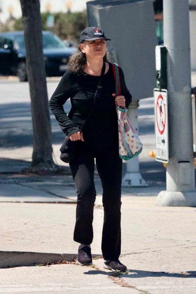 Julia Nickson walking down a street in Los Angeles.