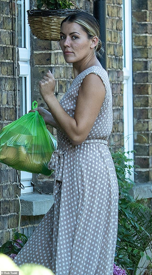 Jasmine Wyld is seen at home in the UK on Friday after returning from the family holiday that ended in her father-in-law's arrest