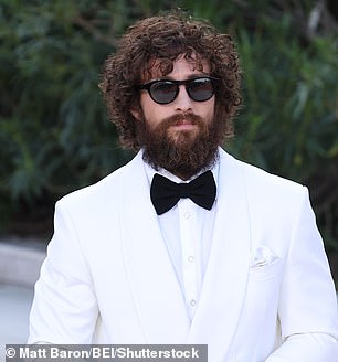 The actor shielded his move star good looks behind a huge bushy beard and dark shades, while his hair was worn in curls