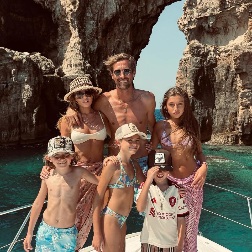 Abbey Clancy and Peter Crouch with their four children on a boat trip.