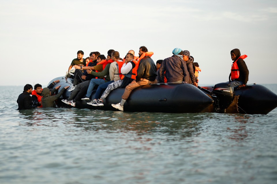 Migrants in an inflatable boat crossing the English Channel.