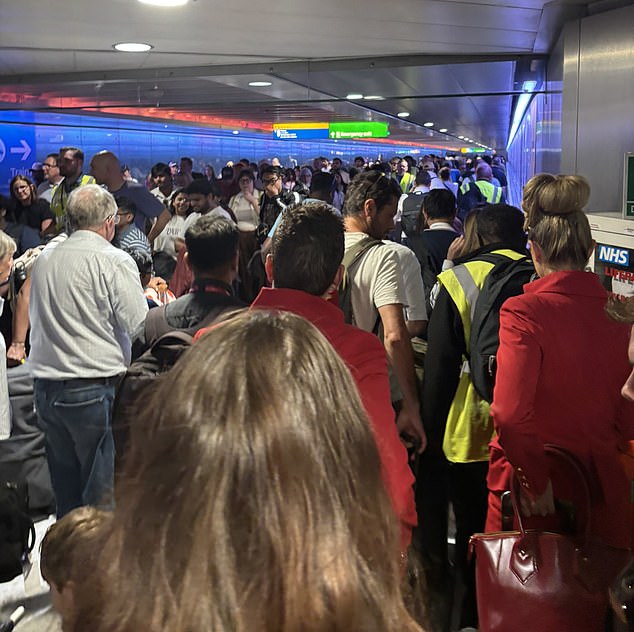 Passengers queuing inside Heathrow Airport after a 'technical issue' caused the tunnel connecting terminals to close last week