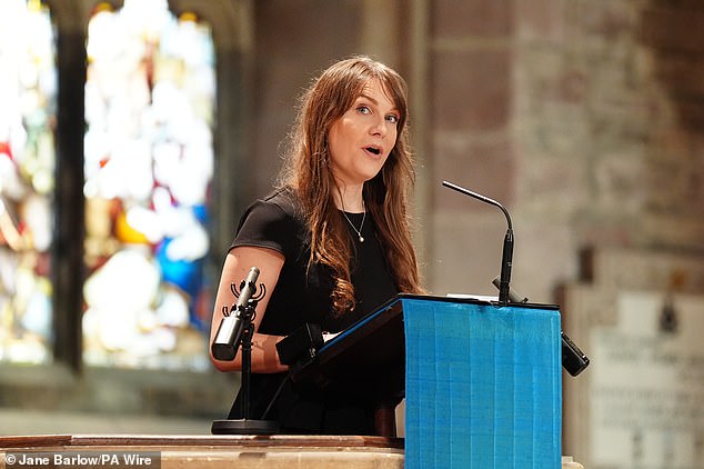Christina Hendry reads an eulogy during at the public memorial service for her uncle