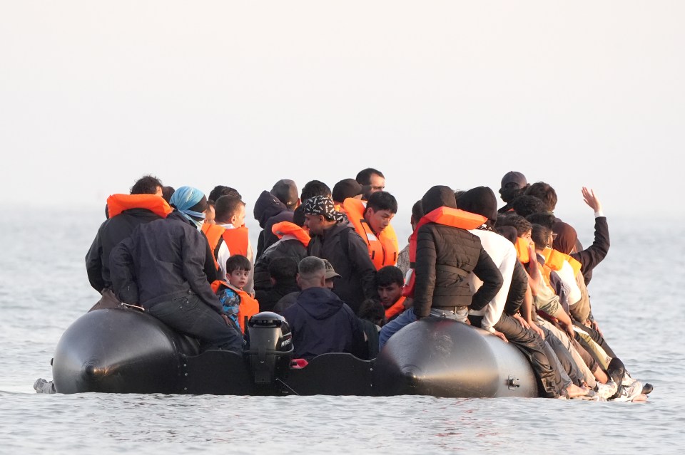 Migrants on an inflatable boat crossing the channel.