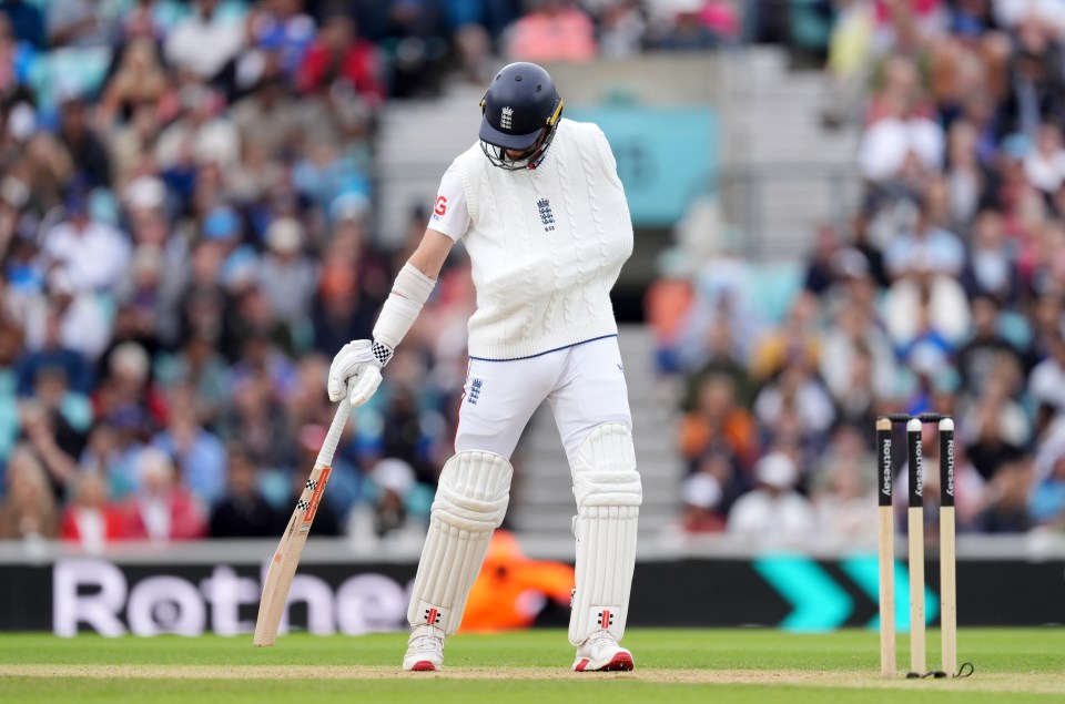 Chris Woakes, arm in a sling, walking with his cricket bat.