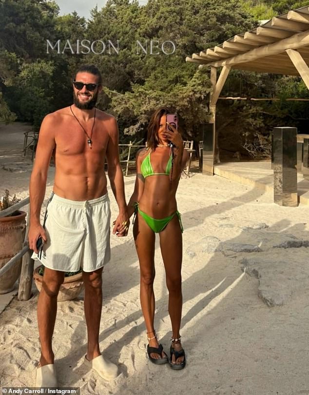 Andy Carroll has reportedly defied his football club boss's warnings over his relationship with Lou Teasdale and is 'blinded' by her