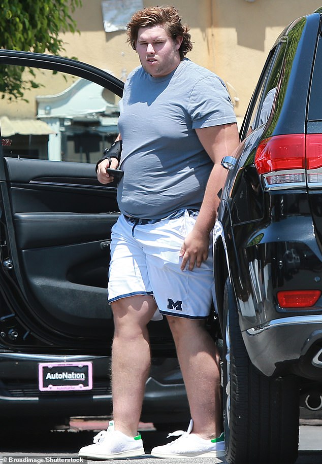 After big brother Patrick, 31, stole scenes with his shirtless moments on The White Lotus , Christopher, 27, made a statement of his own¿rocking a snug short-sleeve shirt and shorts that showed off his impressive transformation; (seen in 2018)