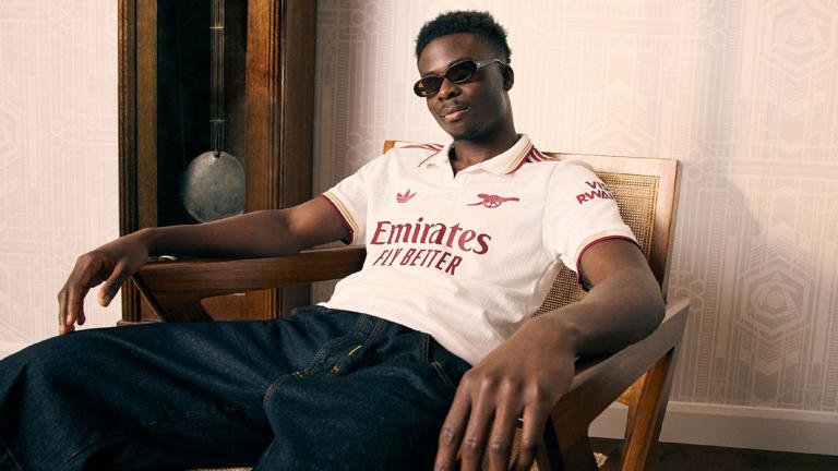 Man wearing Arsenal's third kit.