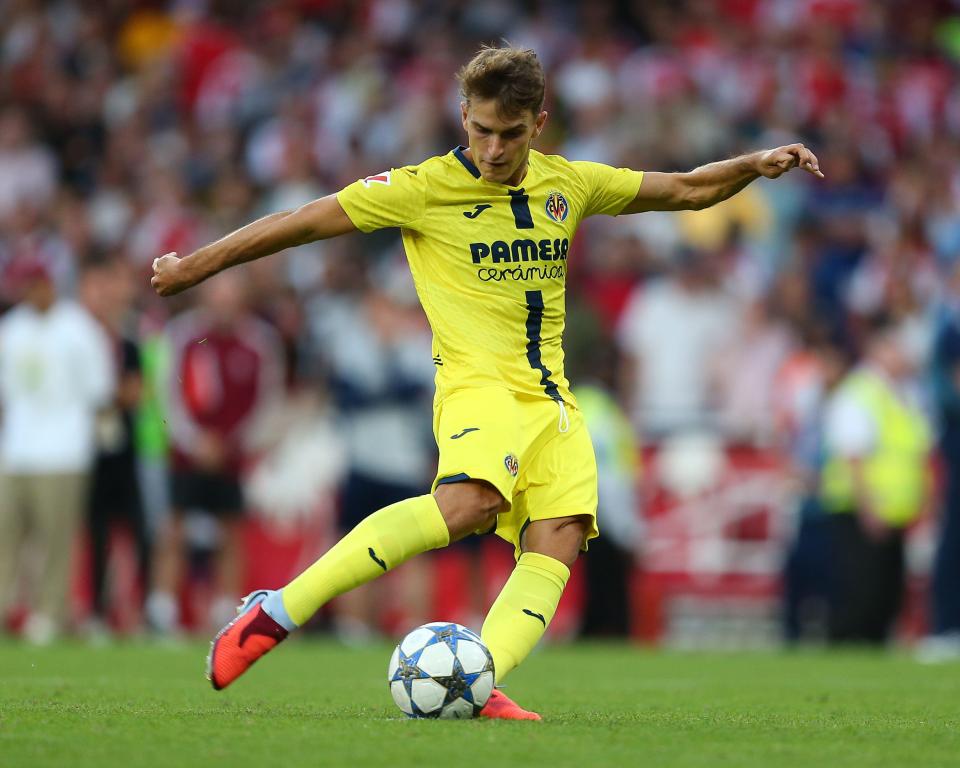 Soccer player taking a penalty kick.