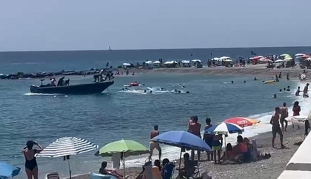 Video footage shows 13 Moroccan men jumping from a speedboat into the sea before running onto Sotillo beach