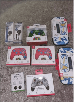 Assortment of gaming accessories including controllers and carrying cases.