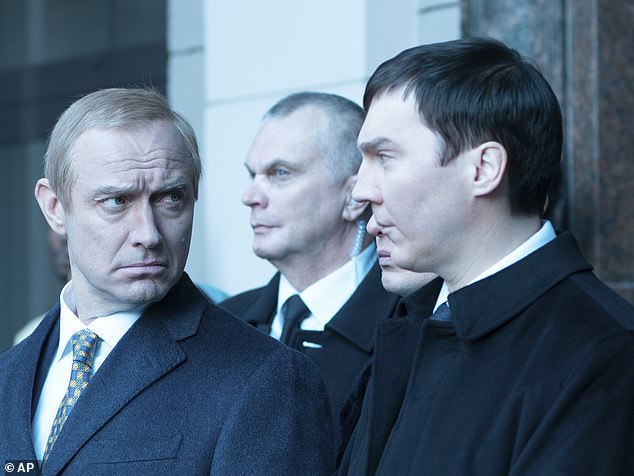 Jude Law as Vladimir Putin (left) alongside Paul Dano, who portrays Vadim Baranov in The Wizard Of The Kremlin