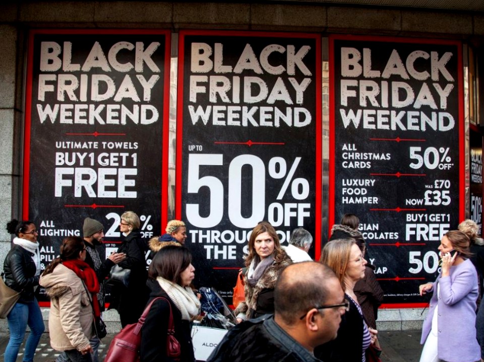 Black Friday Weekend sale signs with shoppers.