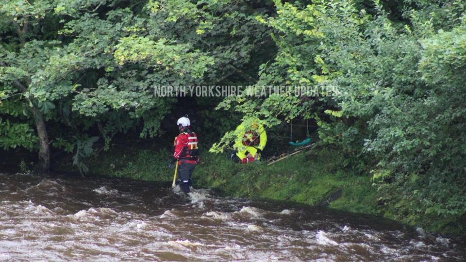Police searching a river after a body was spotted.