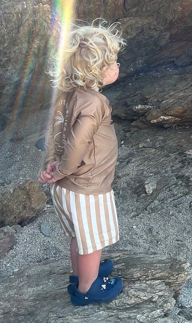 A picture of Frank¿s clasped hands and upright stance as he watched Wilf and sister Romy, three, play while on their recent holiday in Greece was strikingly similar to the former prime minister