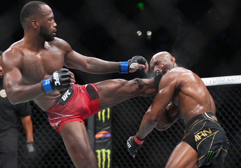 Leon Edwards landing a head kick on Kamaru Usman during a UFC fight.