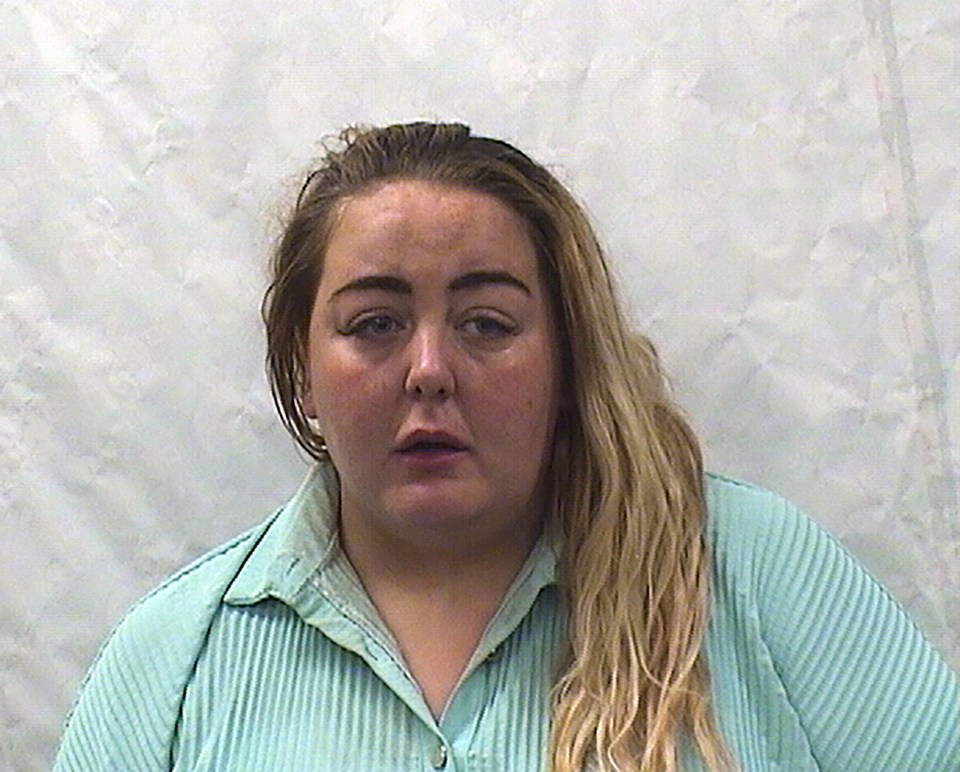 Mugshot of a woman with long blonde hair.