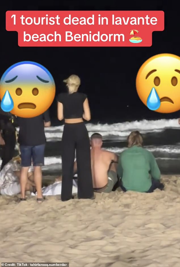 Video footage shows a concerned crowd gathering on the beach as police arrived at the scene
