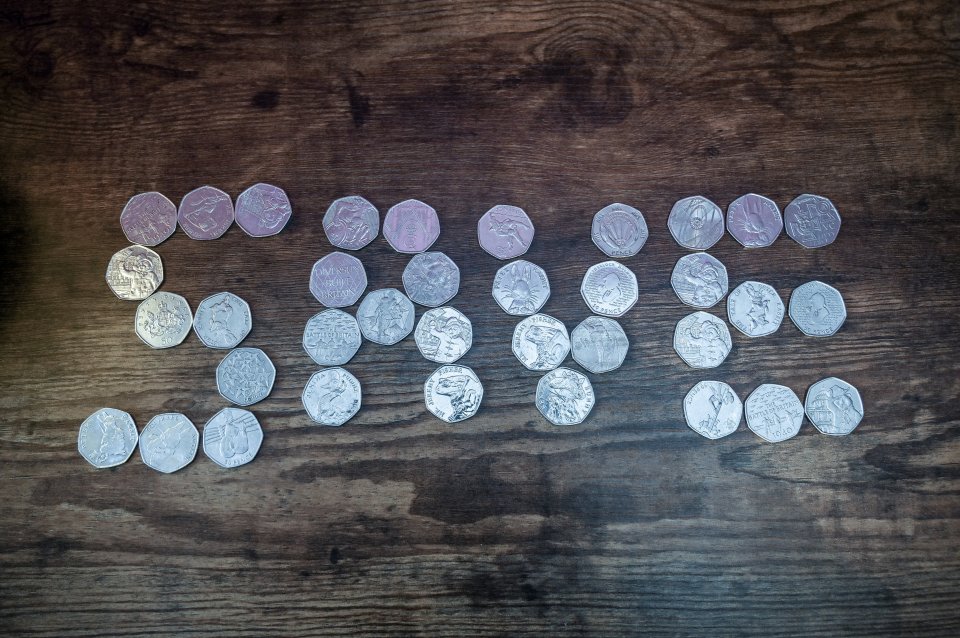 Fifty pence coins arranged to spell "50p".