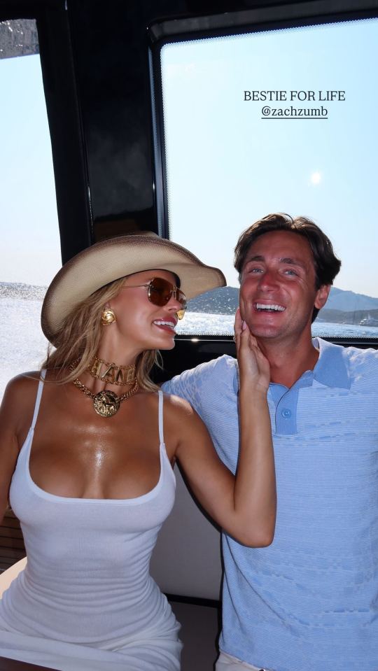 Brooks Nader and a man on a yacht.