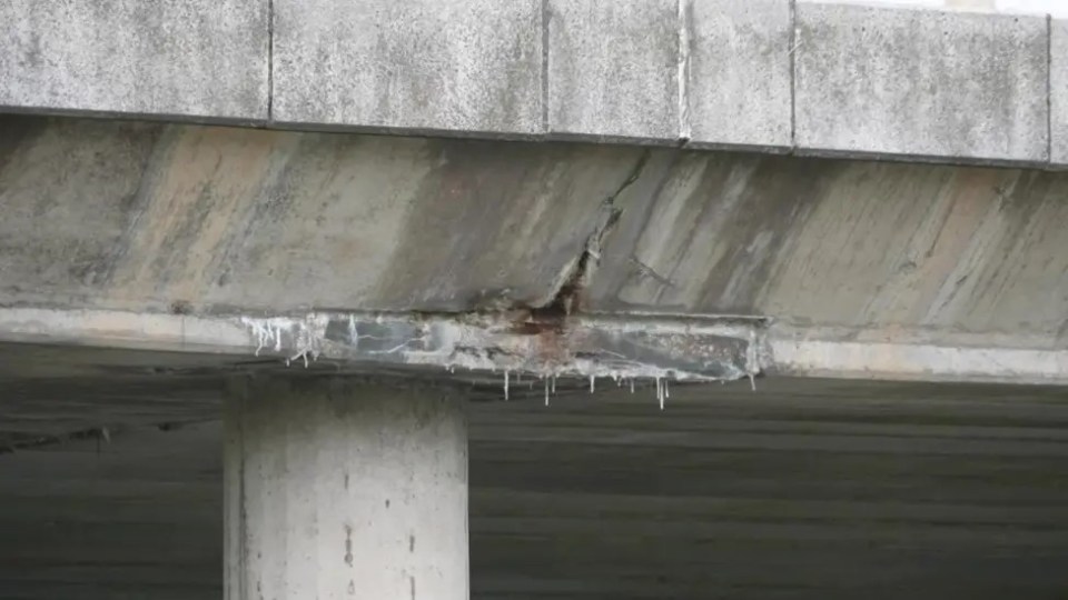Damaged motorway bridge requiring repairs.