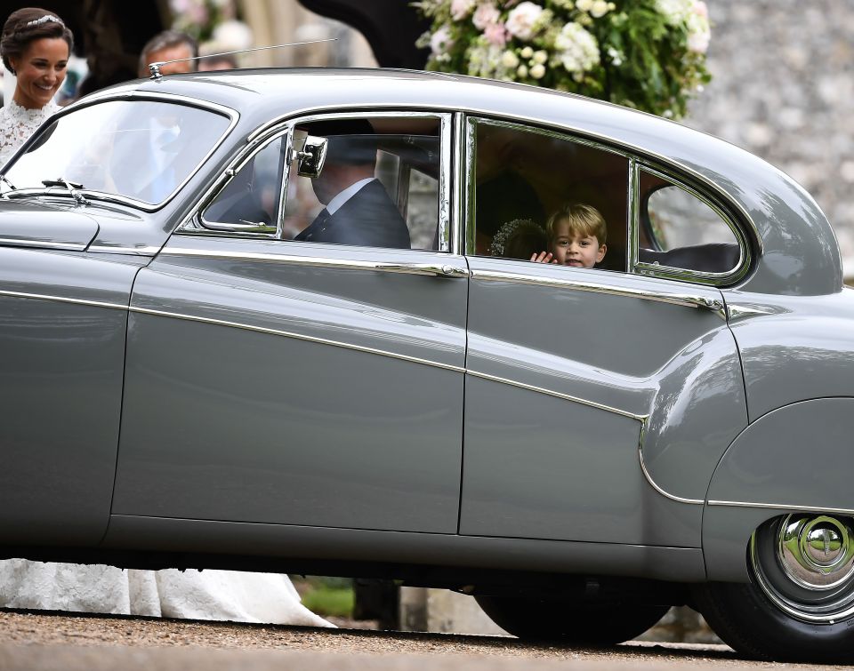 Prince George waving from a car at Pippa Middleton's wedding.